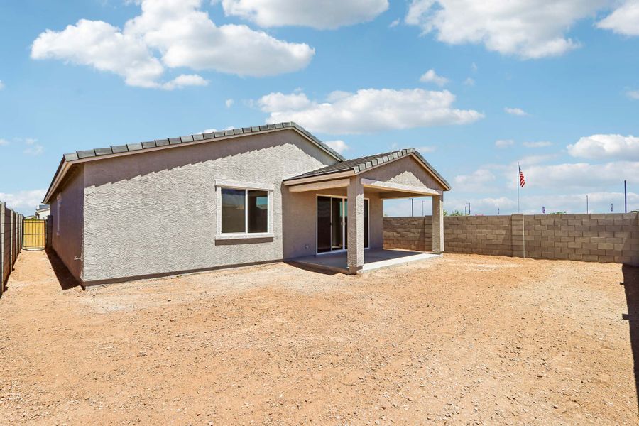 A building with a dirt yard.