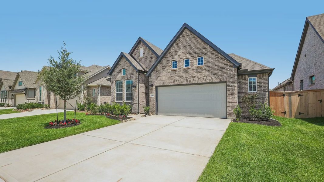 Representative exterior photo of a completed home built from the Oxford by Chesmar Homes in Parkside on the River, Georgetown, TX (Image 21).