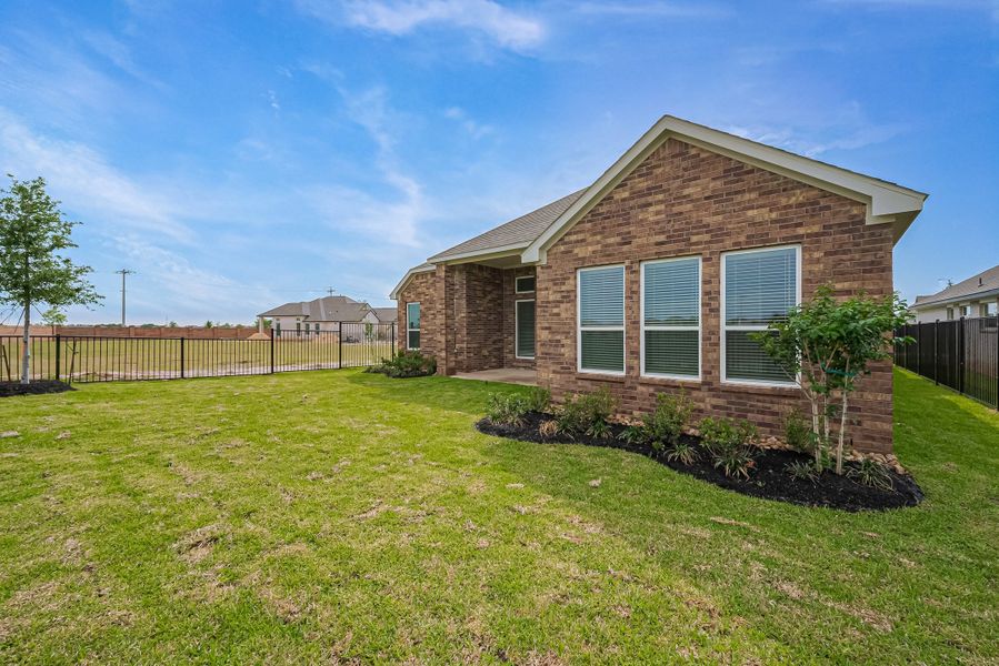 Representative exterior photo of a completed home built from the 2620 by Colina Homes in River Ranch, Dayton, TX (Image 29).
