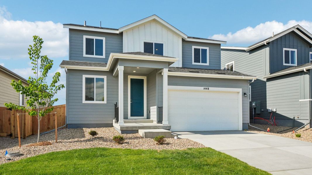 Front exterior of a new home in Trevenna, Windsor, CO, highlighting curb appeal (Image 2). Front exterior of a new home in Trevenna, Windsor, CO, highlighting curb appeal (Image 2).