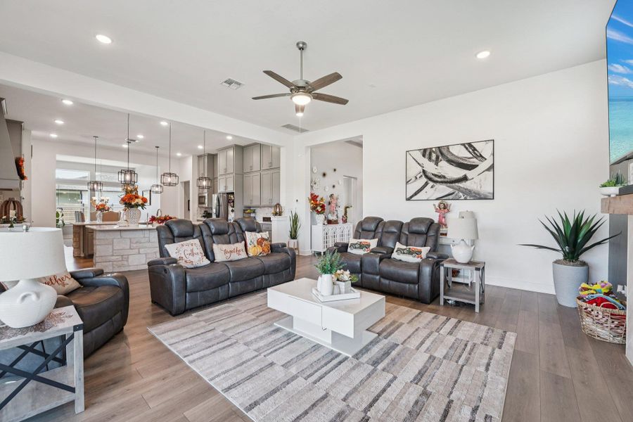 Hardwood flooring and neutral tones create a warm, inviting atmosphere ideal for relaxing or entertaining.