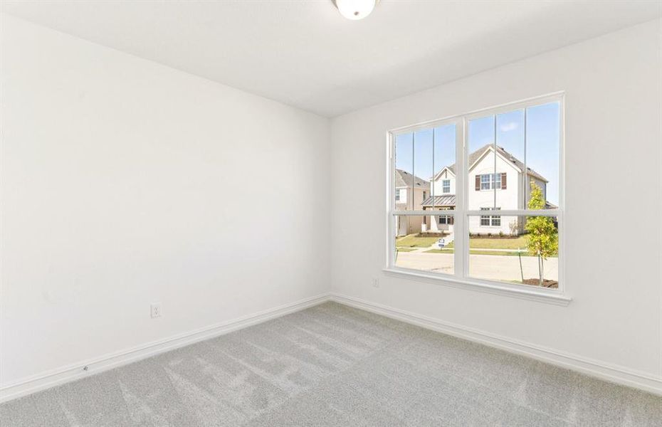 Comfortable bedroom with a bright window view Comfortable bedroom with a bright window view