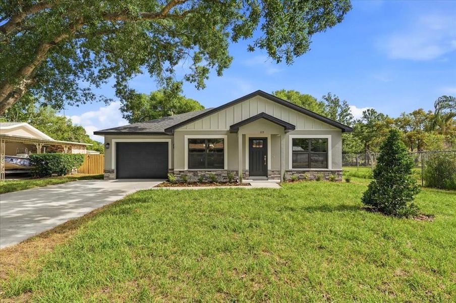 Front exterior of a new home in , Auburndale, FL, highlighting curb appeal (Image 28).