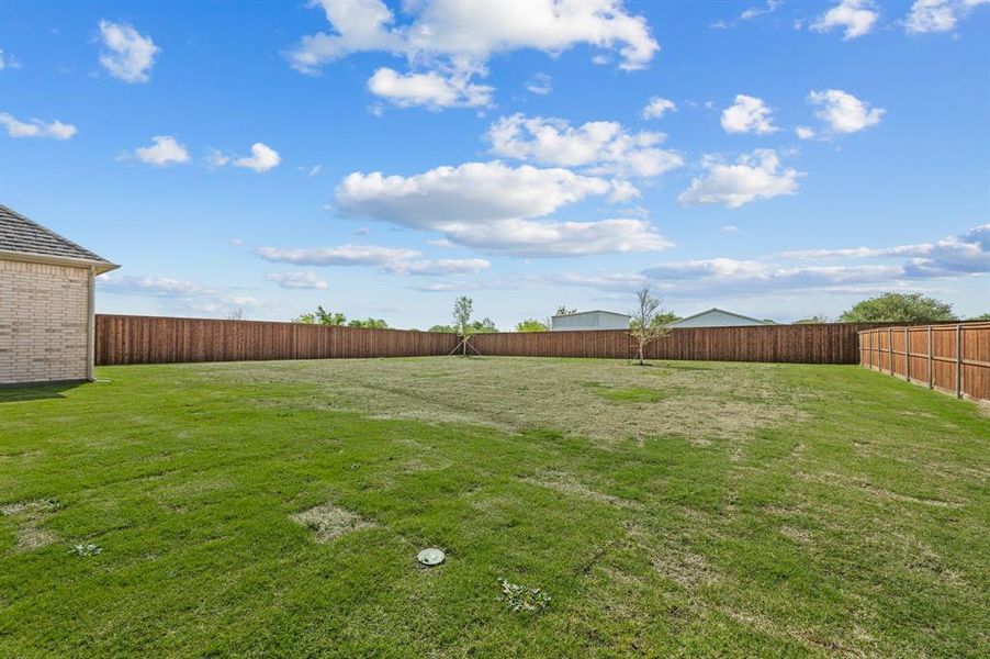 Exterior details and patio area of a home in NorthGlen, Haslet (Image 28).