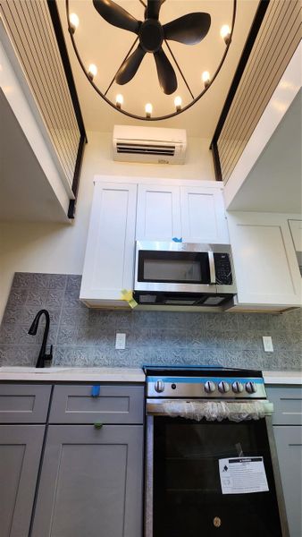 Kitchen looking up to 7' x 7' lofts, ductless HVAC and fandelier. Kitchen looking up to 7' x 7' lofts, ductless HVAC and fandelier.