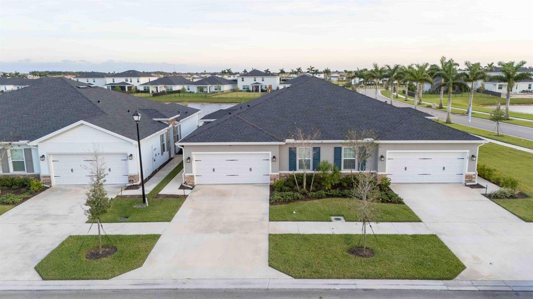 Front exterior of a new home in Central Park Villas, Port St. Lucie, FL, highlighting curb appeal (Image 15). Front exterior of a new home in Central Park Villas, Port St. Lucie, FL, highlighting curb appeal (Image 15).