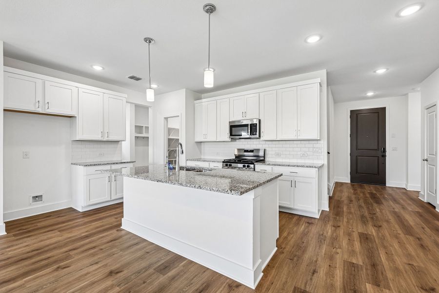 Furnished interior view inside a new home in Freedom at Anthem, Kyle (Image 5).
