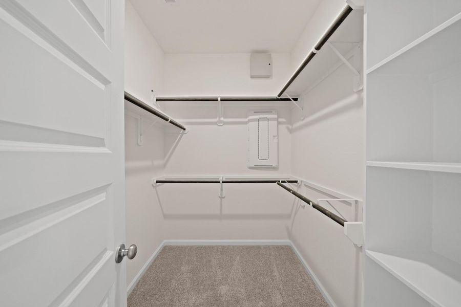 Walk-in closet in the primary suite Walk-in closet in the primary suite