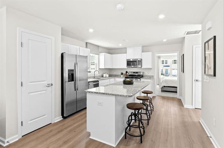 Representative furnished interior of a home built from the Reese by Ryan Homes in Middle Creek Village Coastal Cottages & Villas, Bolivia (Image 10).