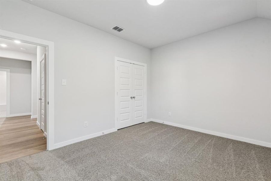 Bedroom in the Oscar home plan by Trophy Signature Homes – REPRESENTATIVE PHOTO