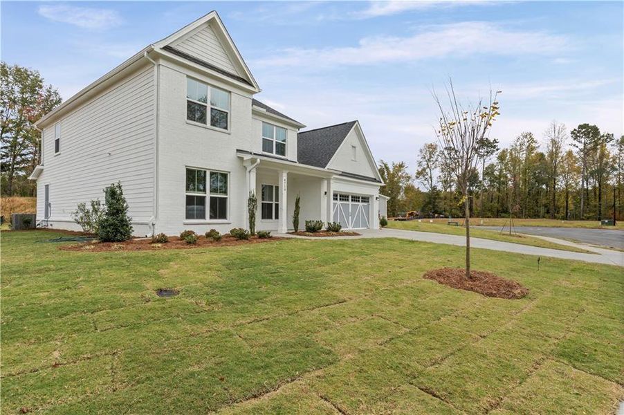 Front exterior of a new home in Rose Creek, Cumming, GA, highlighting curb appeal (Image 23).