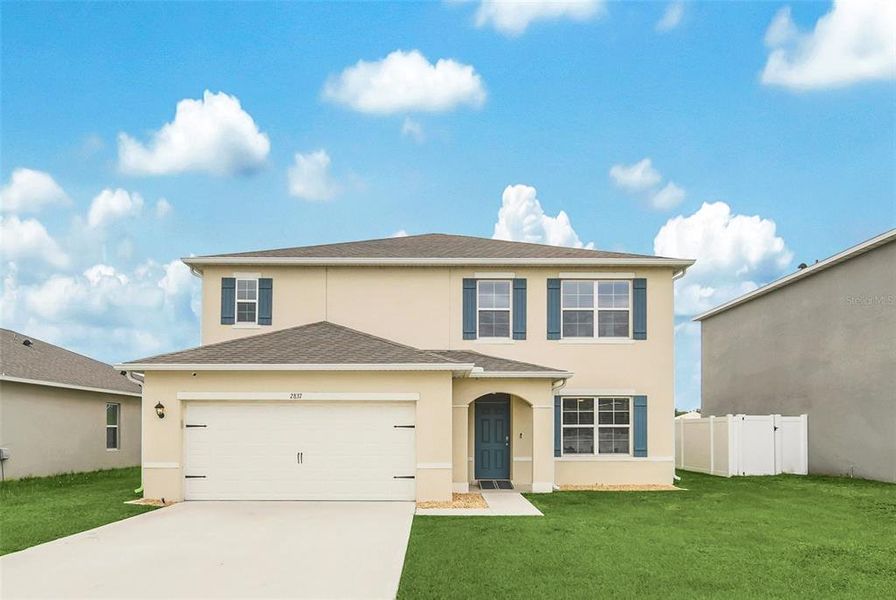 Front exterior of a new home in Greenbrier, Tavares, FL, highlighting curb appeal (Image 28).