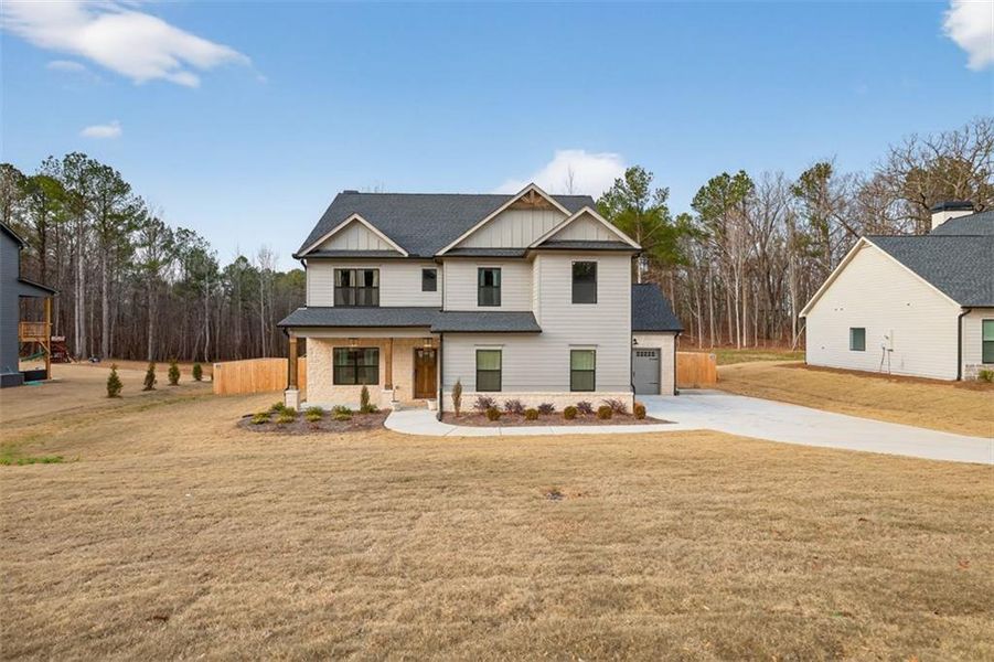 Front exterior of a new home in , Winder, GA, highlighting curb appeal (Image 25). Front exterior of a new home in , Winder, GA, highlighting curb appeal (Image 25).