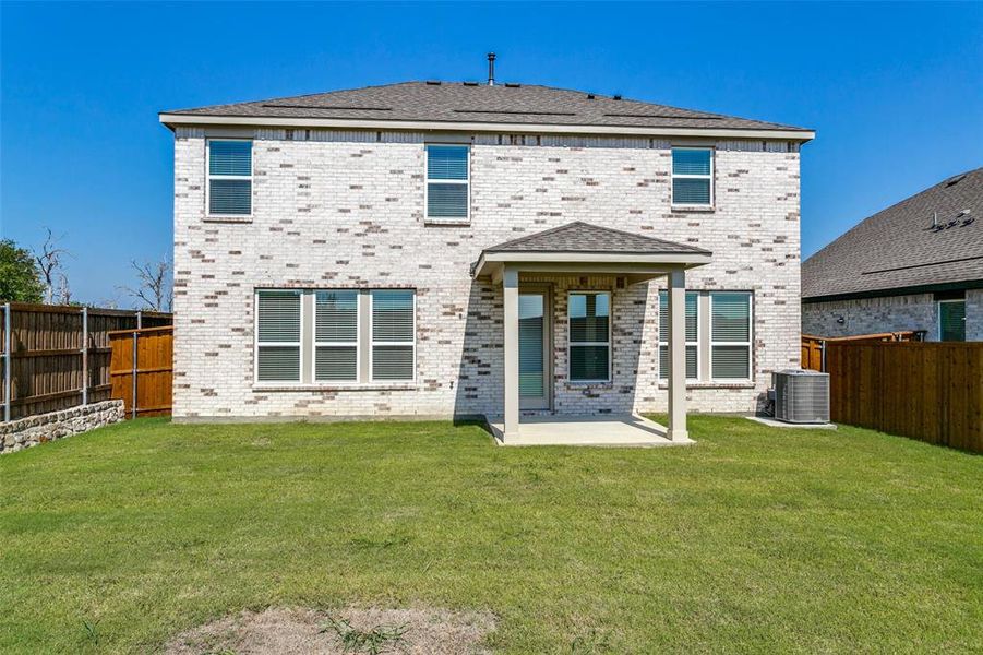 Exterior details and patio area of a home in The Preserve, Justin (Image 3).