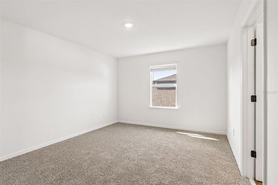 Spacious, unfurnished interior of a new home in The Grove at Stuart Crossing - Signature Series, Bartow (Image 36).