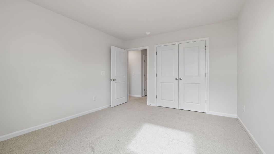 Spacious, unfurnished interior of a new home in Tanglewood Townes, Greenville (Image 22).