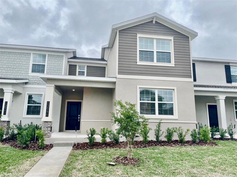 Front exterior of a new home in , Winter Garden, FL, highlighting curb appeal (Image 2). Front exterior of a new home in , Winter Garden, FL, highlighting curb appeal (Image 2).