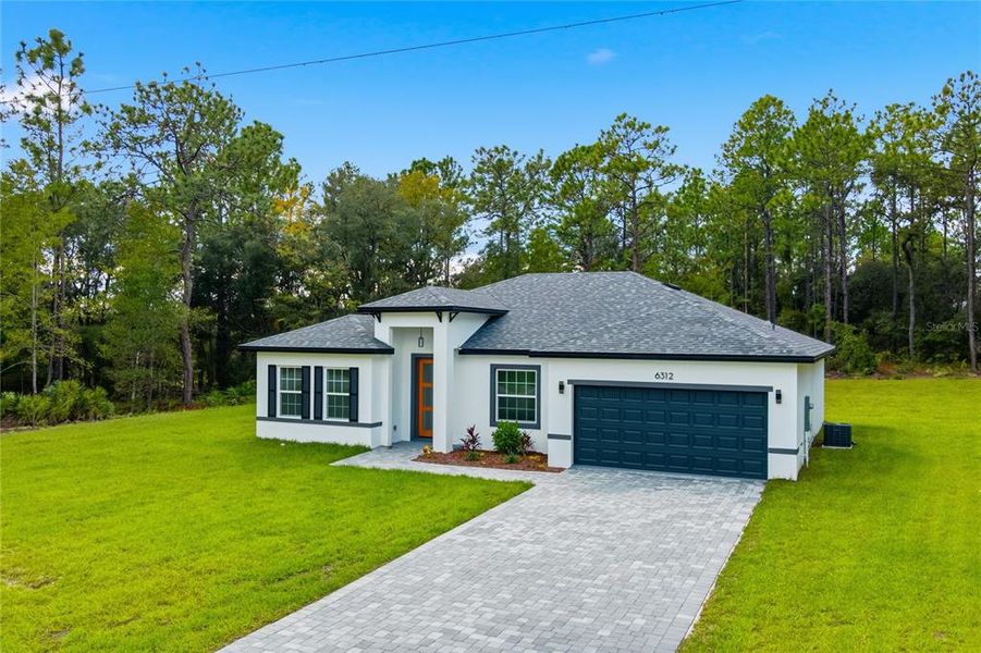 Front exterior of a new home in , Ocala, FL, highlighting curb appeal (Image 17).