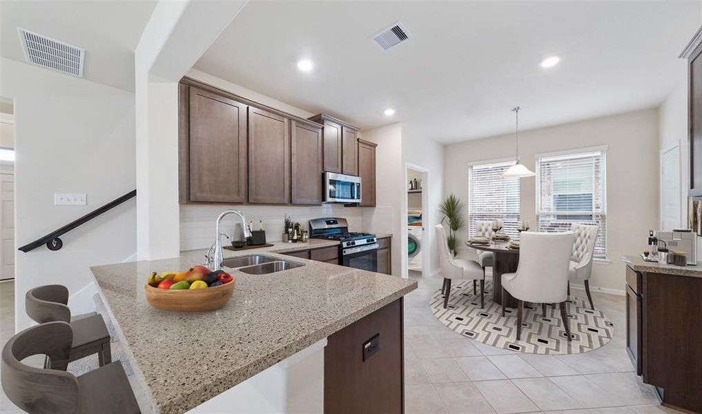 Lovely kitchen and dining area (*Photo not of actual home and used for illustration purposes only.)