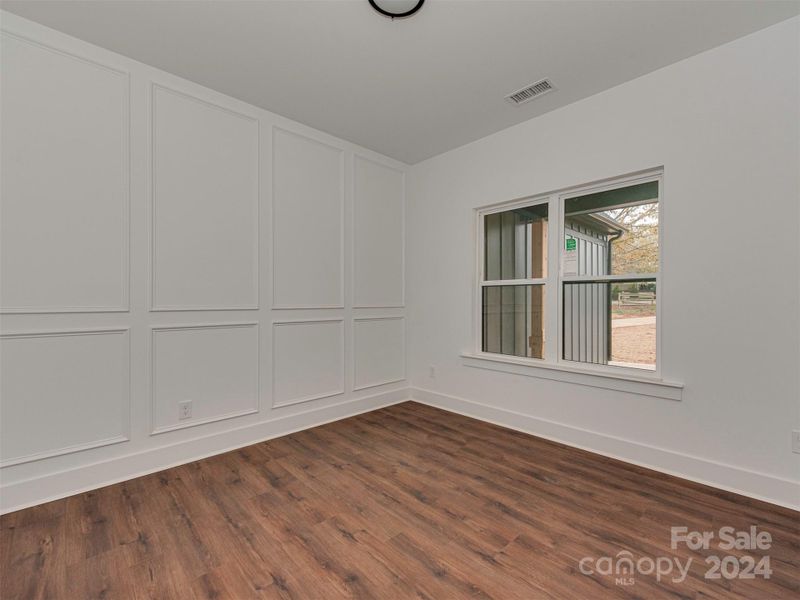 Office with pocket door and molding