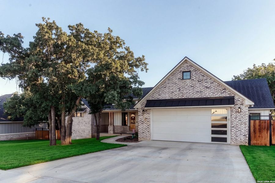 Front exterior of a new home in , La Vernia, TX, highlighting curb appeal (Image 25).