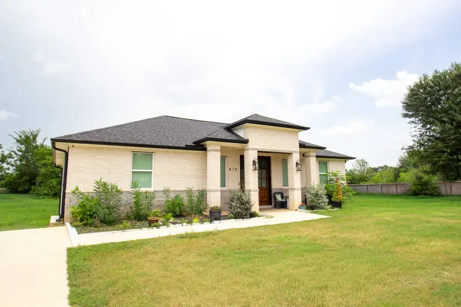 Front exterior of a new home in , Prairie View, TX, highlighting curb appeal (Image 1). Front exterior of a new home in , Prairie View, TX, highlighting curb appeal (Image 1).