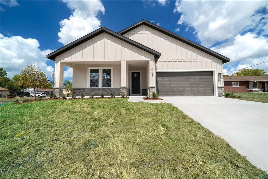 Front exterior of a new home in , Spring Hill, FL, highlighting curb appeal (Image 25).