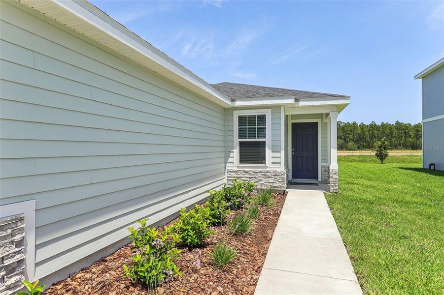 Exterior details and patio area of a home in Flagler Village - Classic Series, Palm Coast (Image 18).