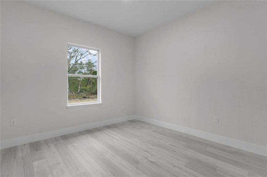 Bedroom 3 with window looking into the back yard