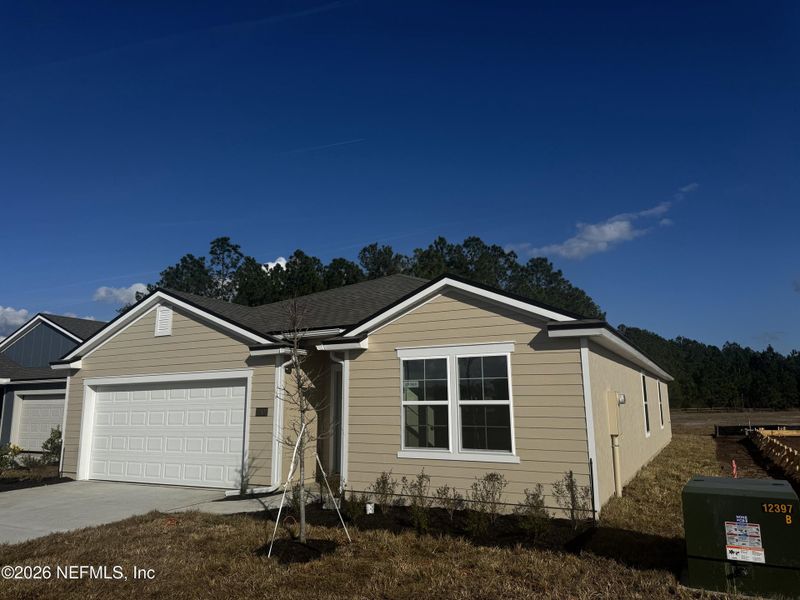 Front exterior of a new home in The Arbors, Jacksonville, FL, highlighting curb appeal (Image 2).