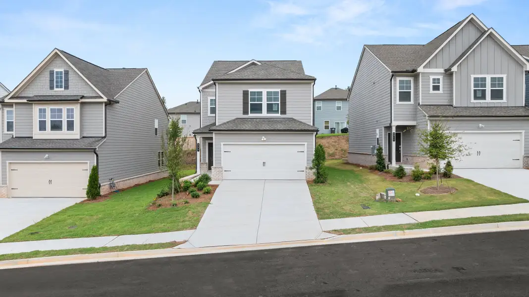 Front exterior of a new home in Timber Ridge: Timber Ridge 42', Douglasville, GA, highlighting curb appeal (Image 1). Front exterior of a new home in Timber Ridge: Timber Ridge 42', Douglasville, GA, highlighting curb appeal (Image 1).