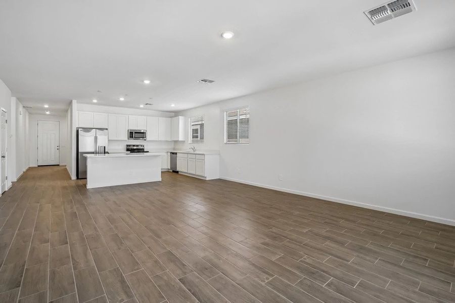 Great room and kitchen. Representative images and renderings are for illustrative purposes. Actual structural options and design finishes of home may vary.