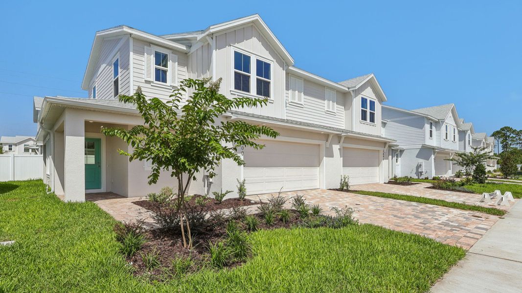 Front exterior of a new home in Cyrene at Harmony, St. Cloud, FL, highlighting curb appeal (Image 20). Front exterior of a new home in Cyrene at Harmony, St. Cloud, FL, highlighting curb appeal (Image 20).