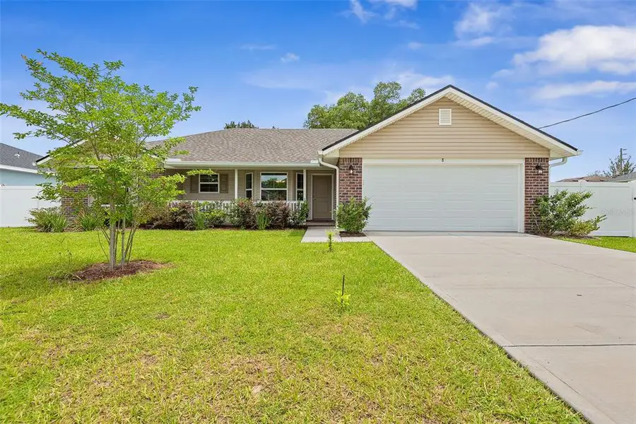 Front exterior of a new home in Palm Coast, Palm Coast, FL, highlighting curb appeal (Image 20).