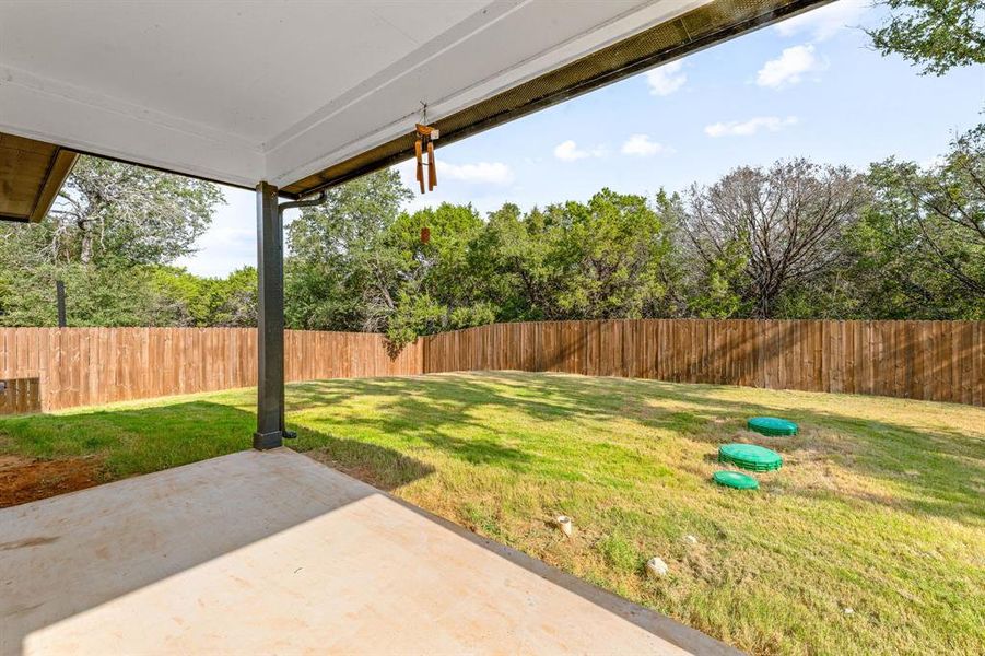 Fenced backyard with a patio Fenced backyard with a patio