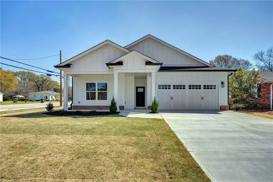 Front exterior of a new home in , Covington, GA, highlighting curb appeal (Image 1). Front exterior of a new home in , Covington, GA, highlighting curb appeal (Image 1).