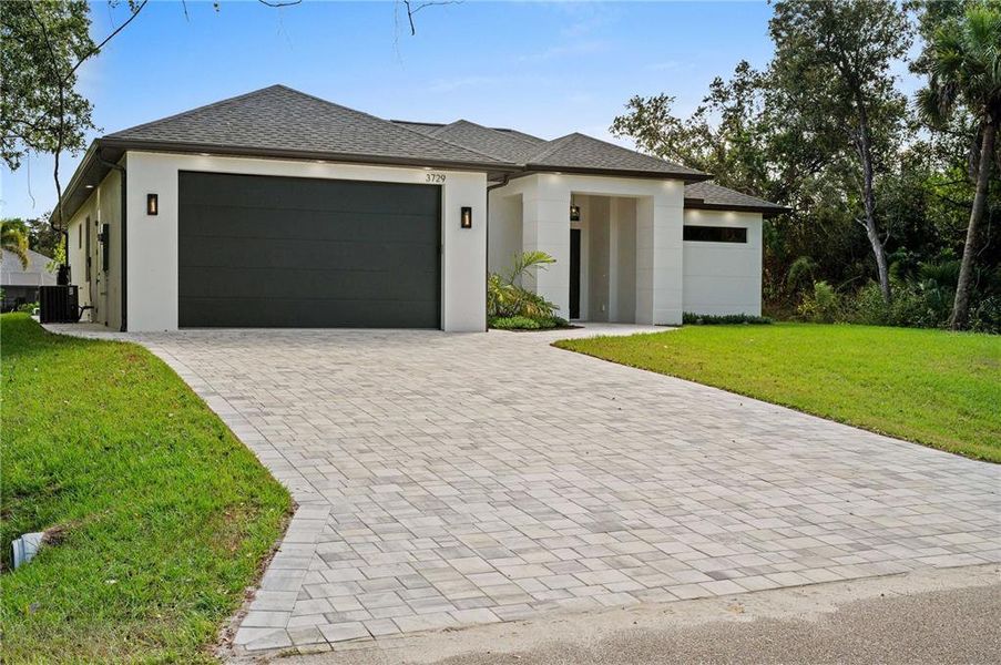 Front exterior of a new home in , North Port, FL, highlighting curb appeal (Image 2). Front exterior of a new home in , North Port, FL, highlighting curb appeal (Image 2).