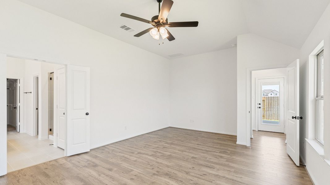 Furnished interior view inside a new home in Sunterra, Katy (Image 23).