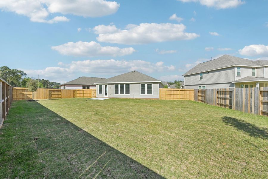 The possibities are endless with this spacious backyard.
