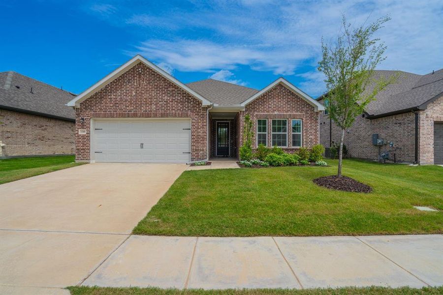 Front exterior of a new home in Devonshire, Forney, TX, highlighting curb appeal (Image 1). Front exterior of a new home in Devonshire, Forney, TX, highlighting curb appeal (Image 1).