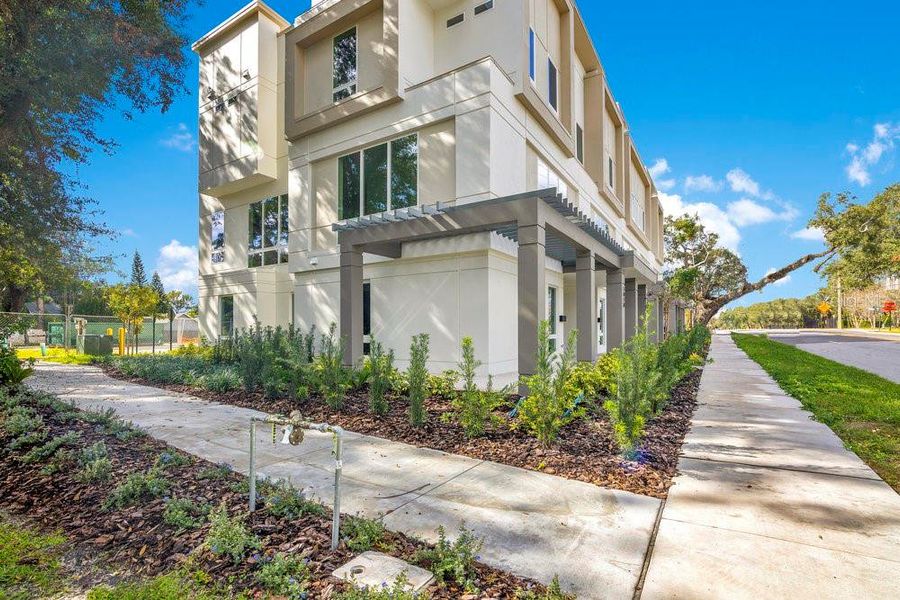 Front exterior of a new home in , Orlando, FL, highlighting curb appeal (Image 27).