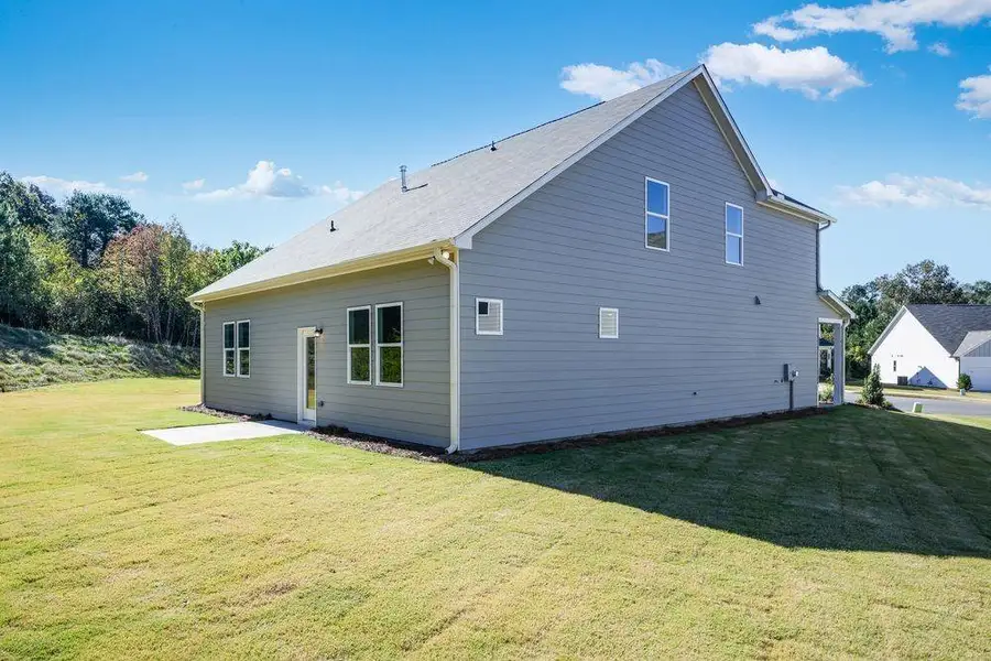 Exterior details and patio area of a home in Heritage River, Euharlee (Image 4).