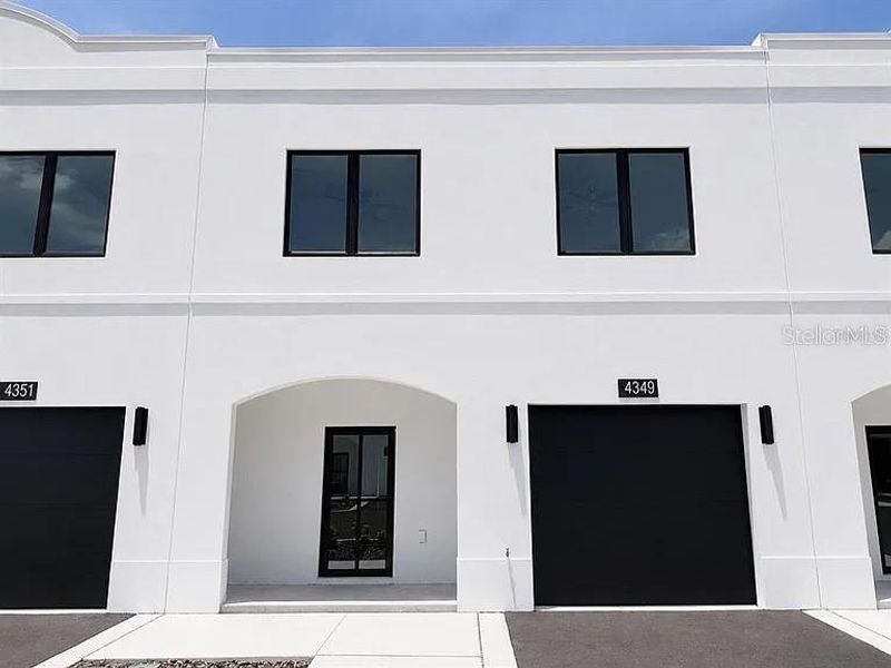 Front exterior of a new home in , Tampa, FL, highlighting curb appeal (Image 19). Front exterior of a new home in , Tampa, FL, highlighting curb appeal (Image 19).