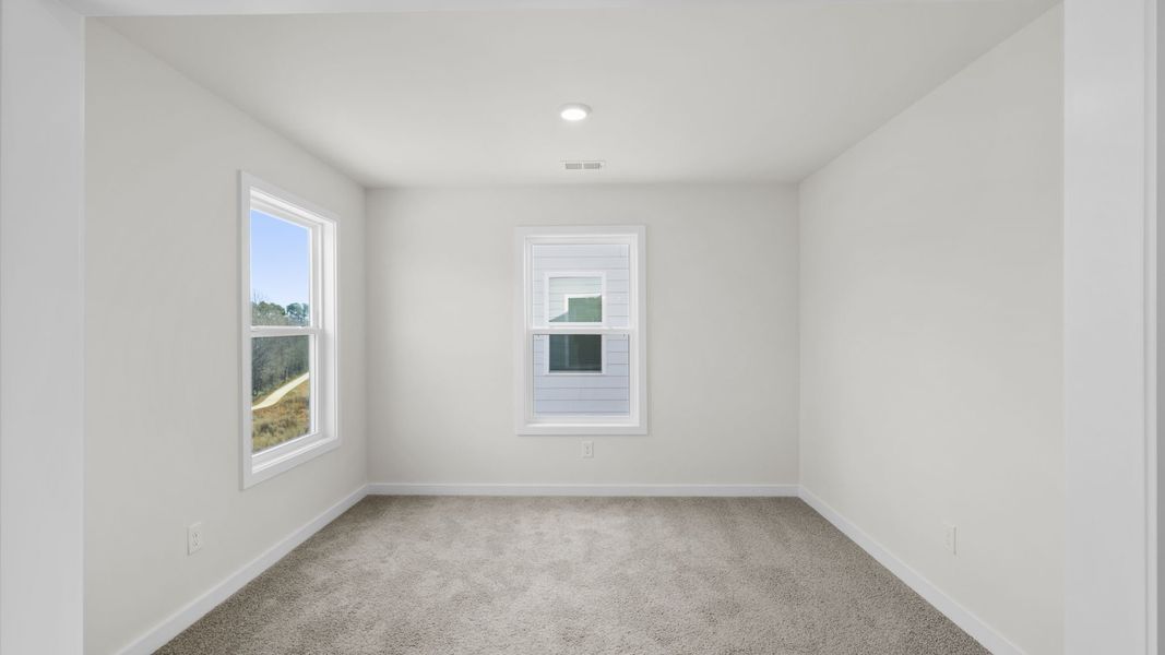 Spacious, unfurnished interior of a new home in Hemlock, Williamston (Image 33).