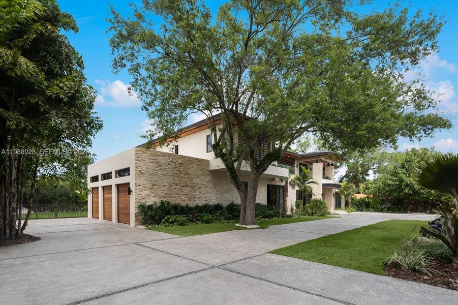 Front exterior of a new home in , Miami, FL, highlighting curb appeal (Image 24).