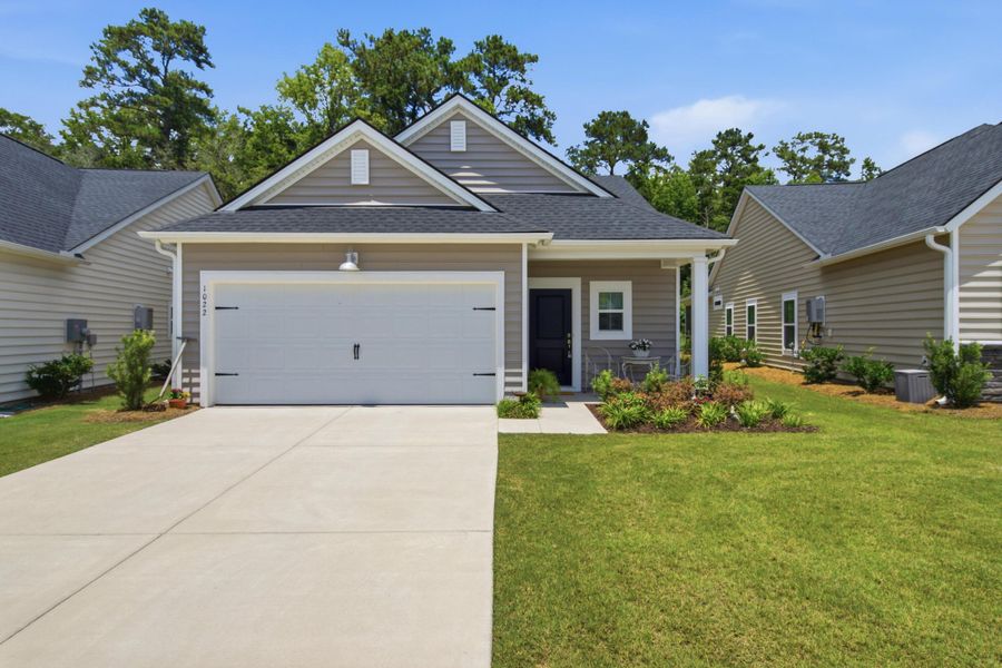 Front exterior of a new home in Horizons at Summers Corner | 55+, Summerville, SC, highlighting curb appeal (Image 26).