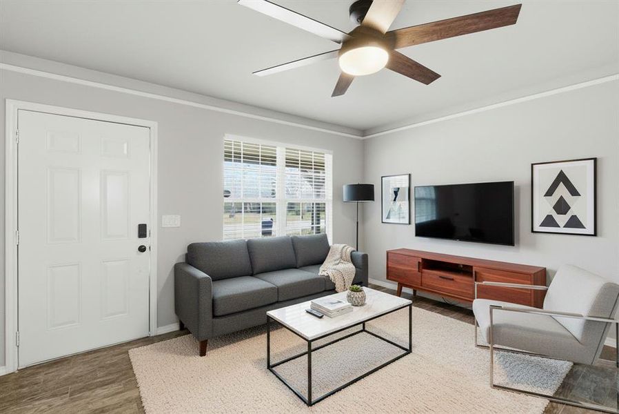 Virtually Staged Living area with crown molding, wood finished floors, and ceiling fan Virtually Staged Living area with crown molding, wood finished floors, and ceiling fan