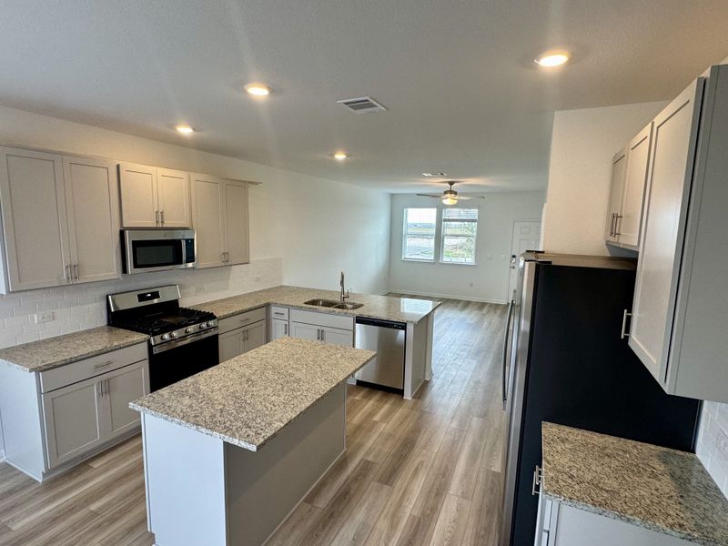 Furnished interior view inside a new home in Longview 40s - Alley, Del Valle (Image 3).