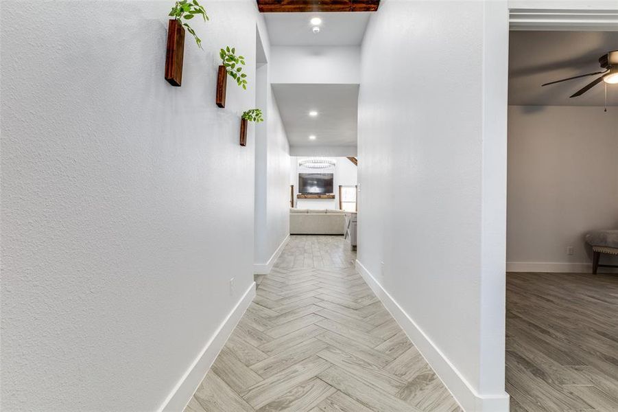 Hall featuring parquet floors and baseboards