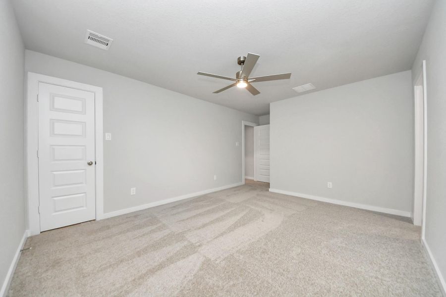Generously sized secondary bedrooms featuring spacious closets, soft and inviting carpeting underfoot, large windows allowing plenty of natural light, and the added touch of privacy blinds for your personal retreat.